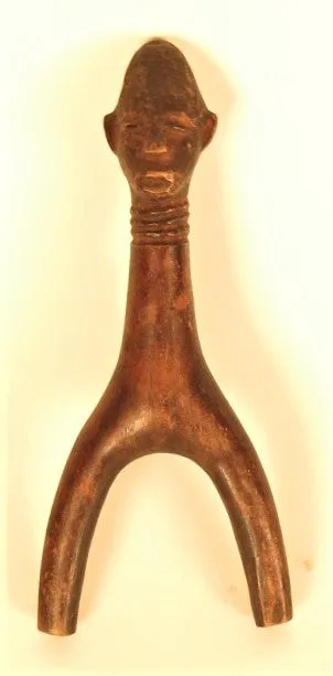 Fang Boys Carved Sling with Faces